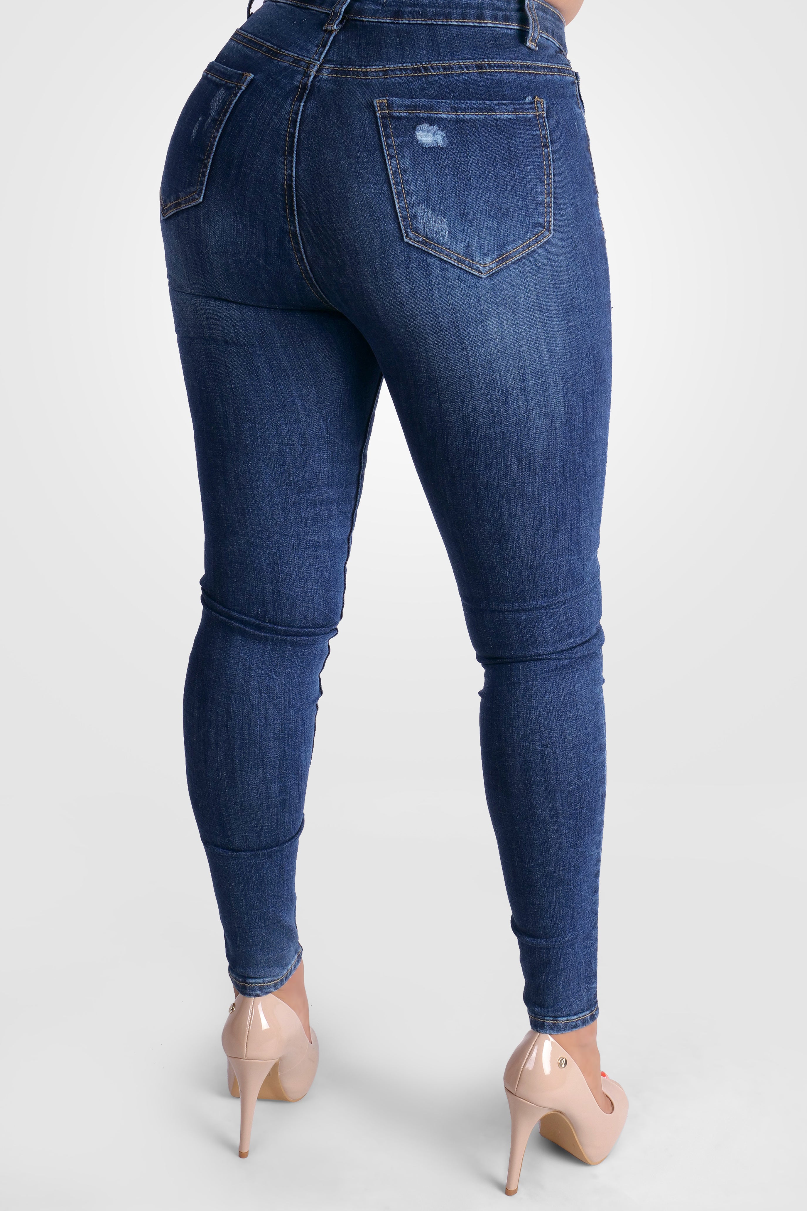 BLAUE STRETCH-JEANS MIT KRATZERN MIT MITTLERER TAILLE